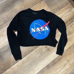 Long sleeves, cropped sweater type top.